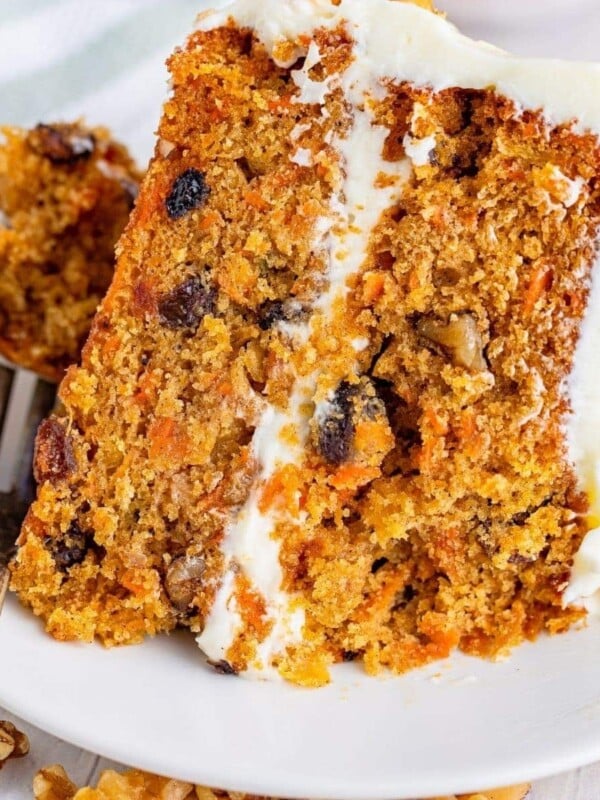 picture of layered carrot cake on a white plate