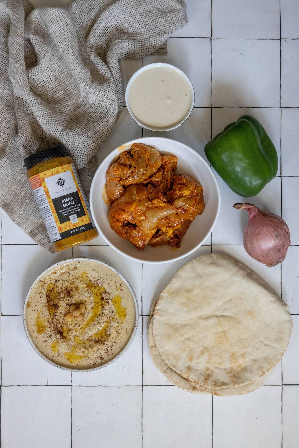 Chicken shawarma pita with hummus and tzatziki.