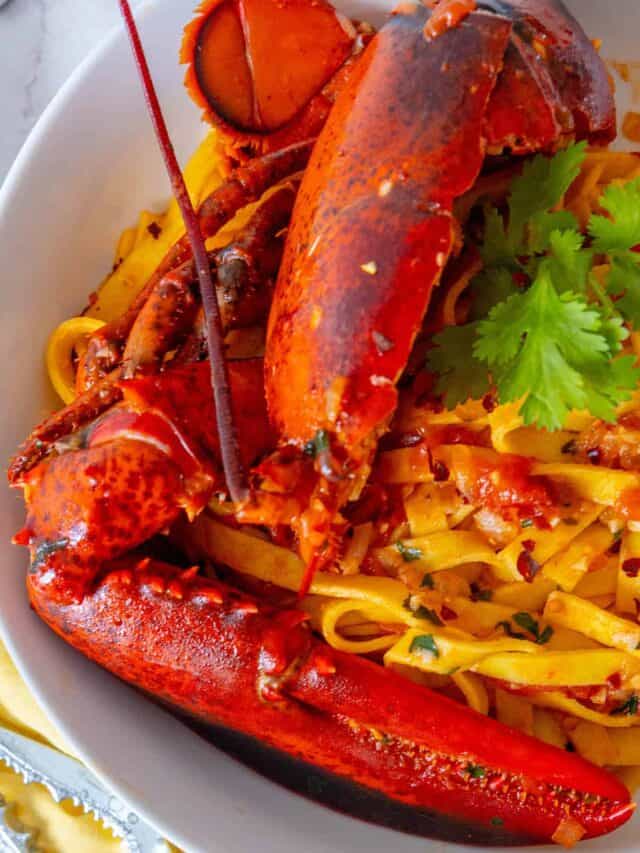 Lobster pasta in a white bowl.