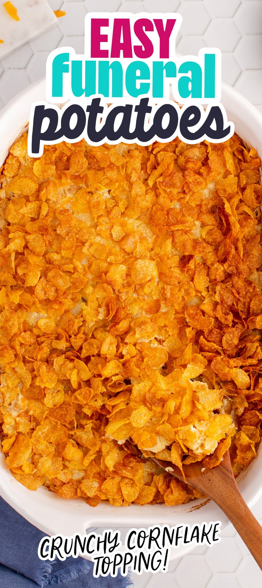 cheesy baked hashbrown casserole topped with cornflakes in a casserole dish