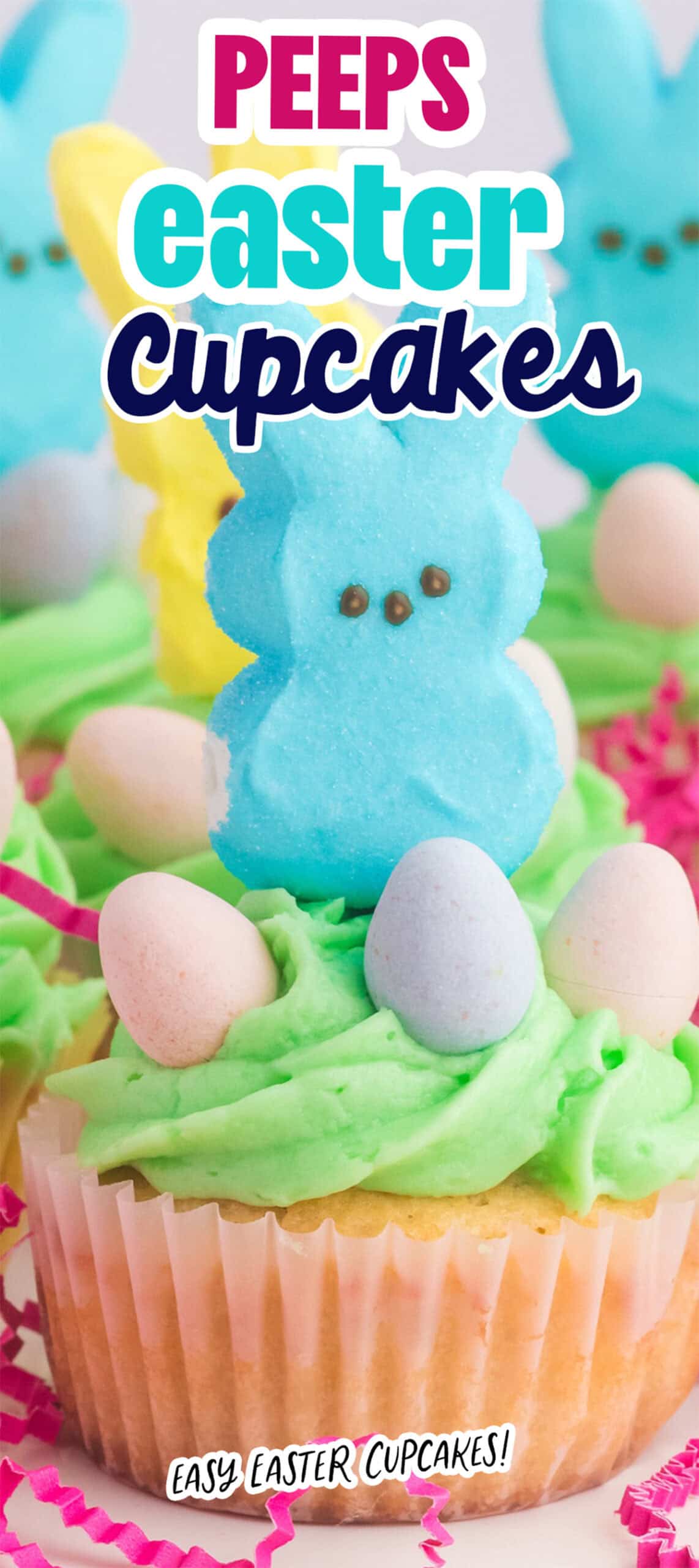 Peeps Cupcakes topped with green frosting, pastel mini eggs, and marshmallow bunny Peeps are delightfully labeled "Peeps Easter Cupcakes.