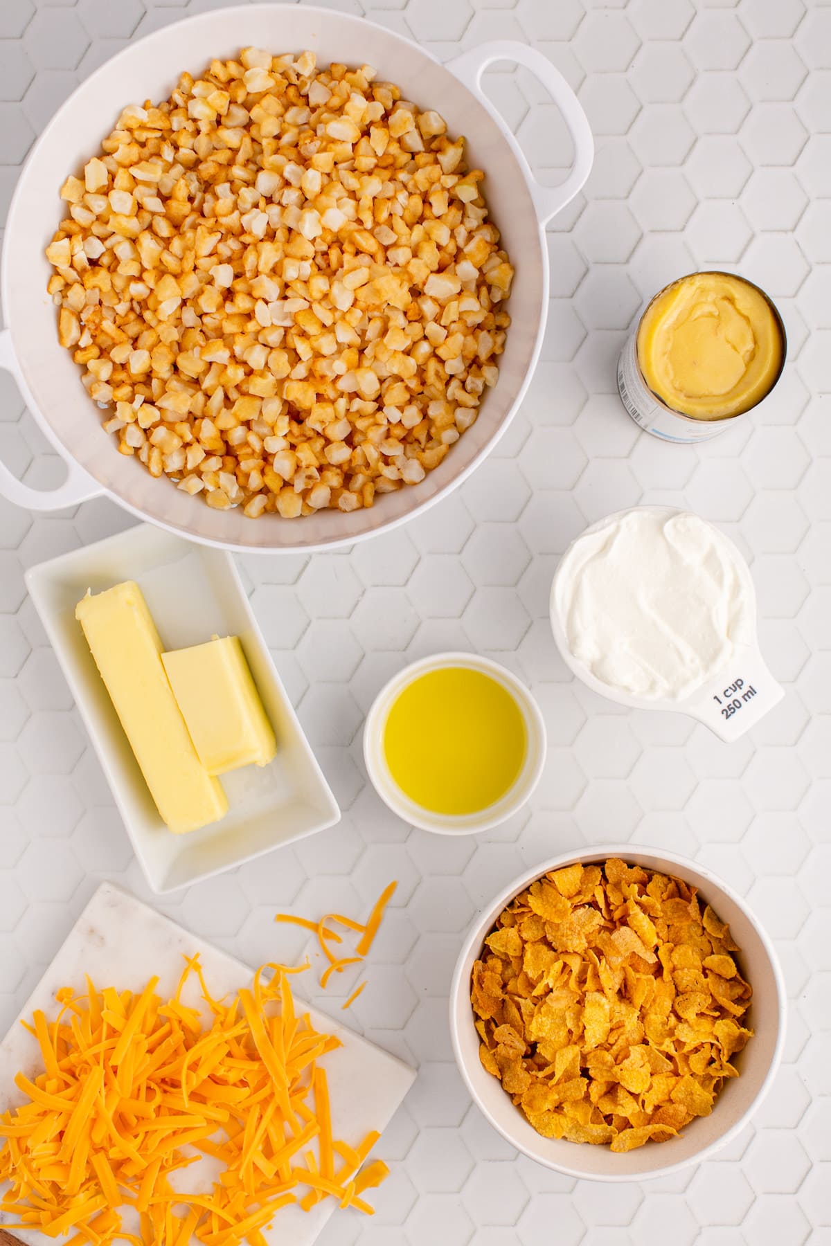 frozen potatoes, butter, sour cream, cheese, potatoes on a table