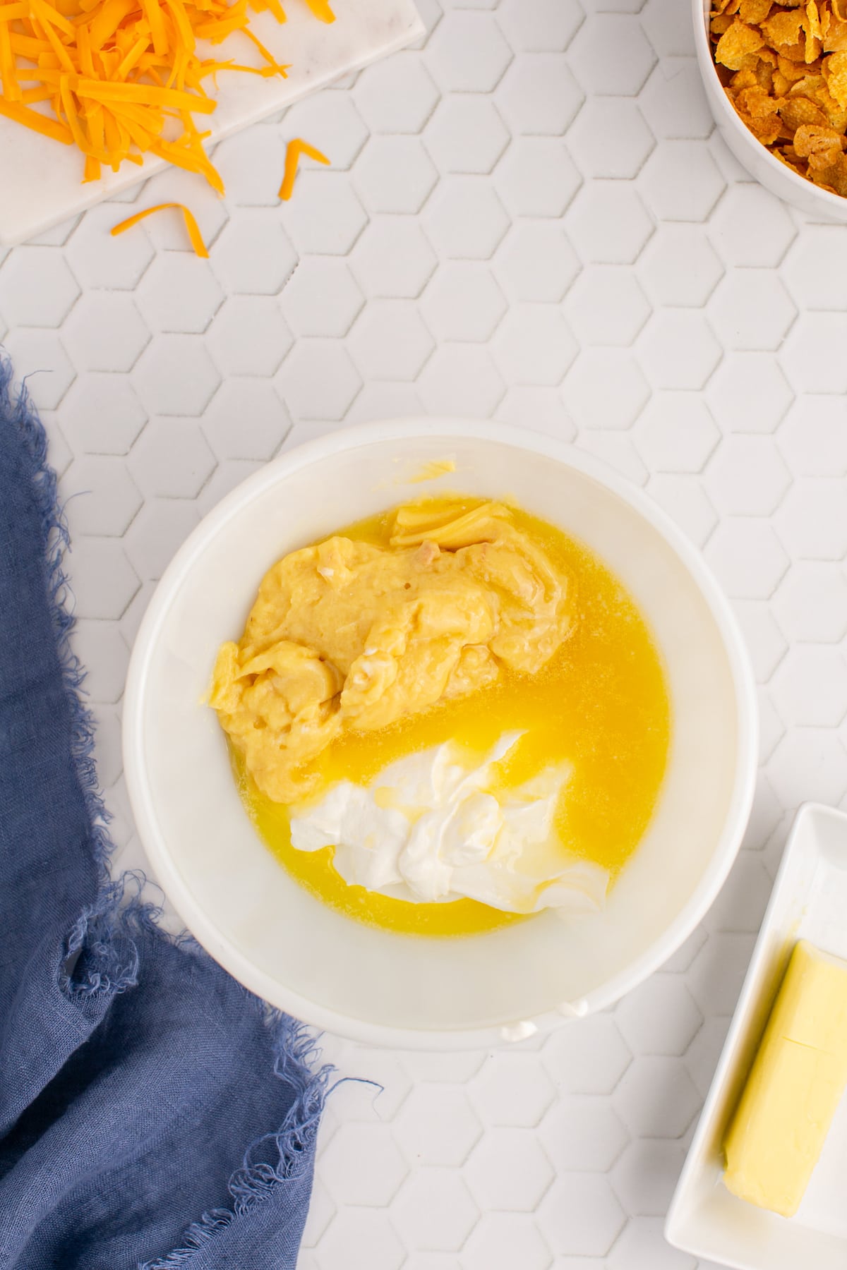 cream, butter, and canned soup in a bowl
