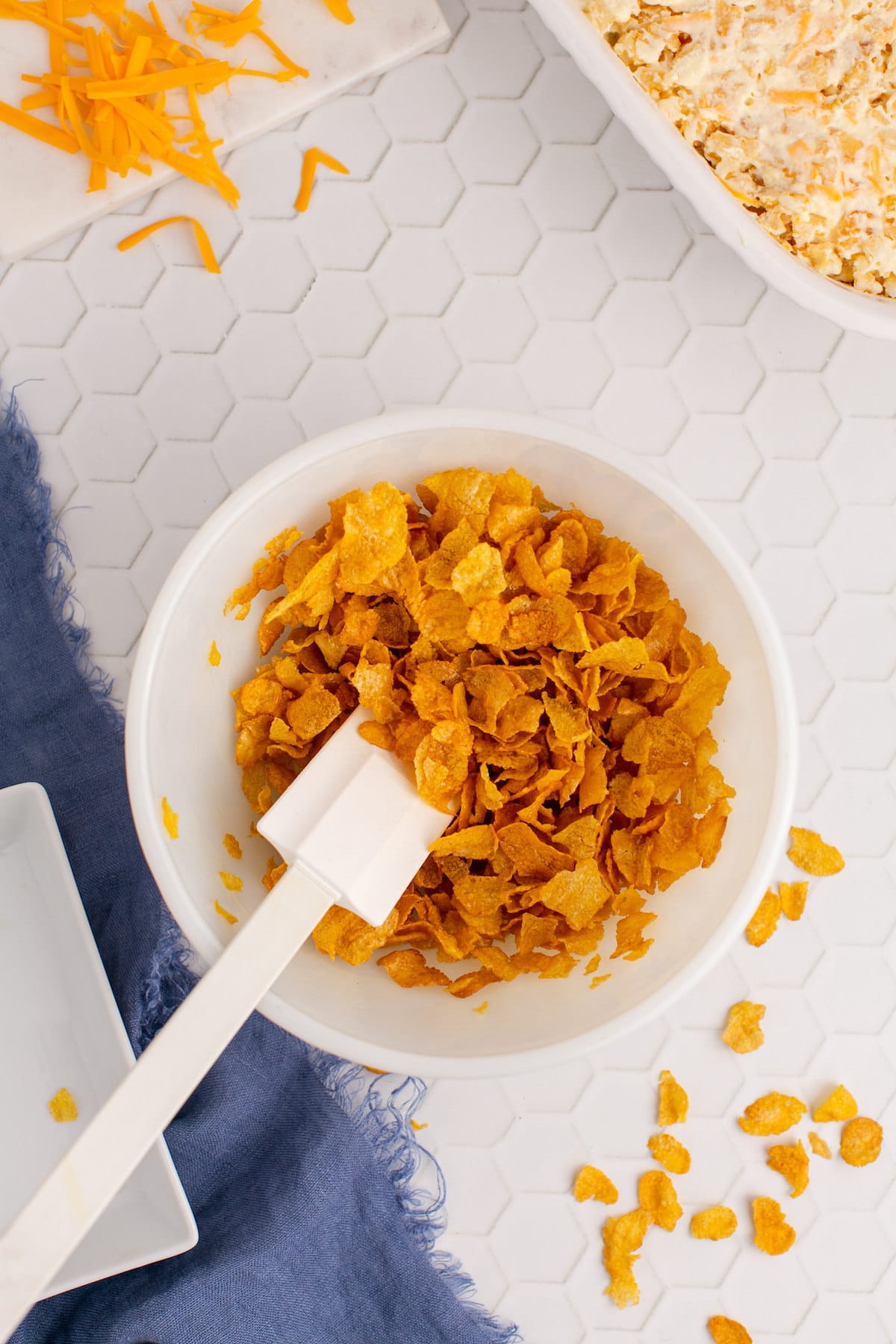a fork crushing up cornflakes