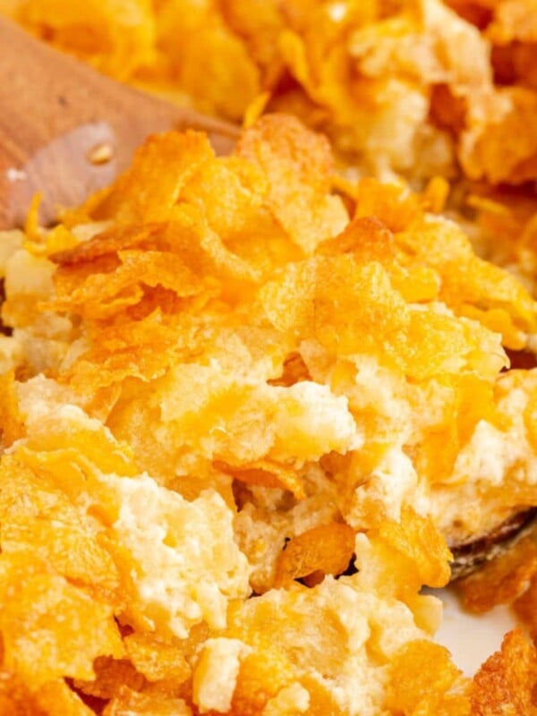 cheesy baked potatoes in a dish topped with cornflakes