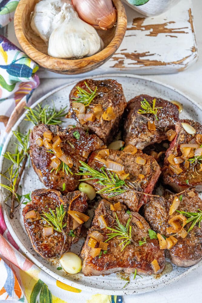 Seared lamb chops with garlic and rosemary.