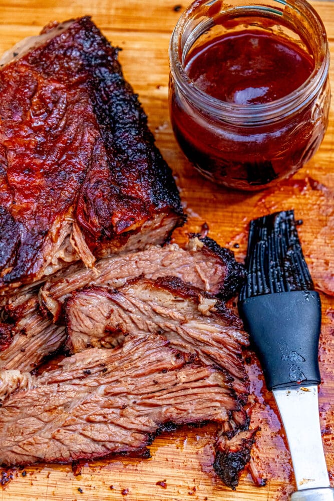 picture of smoked brisket on a wooden cutting board