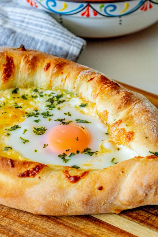 A khachapuri with an egg on top.