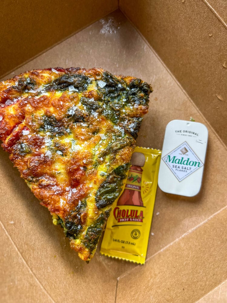 picture of frittata in paper takeout box