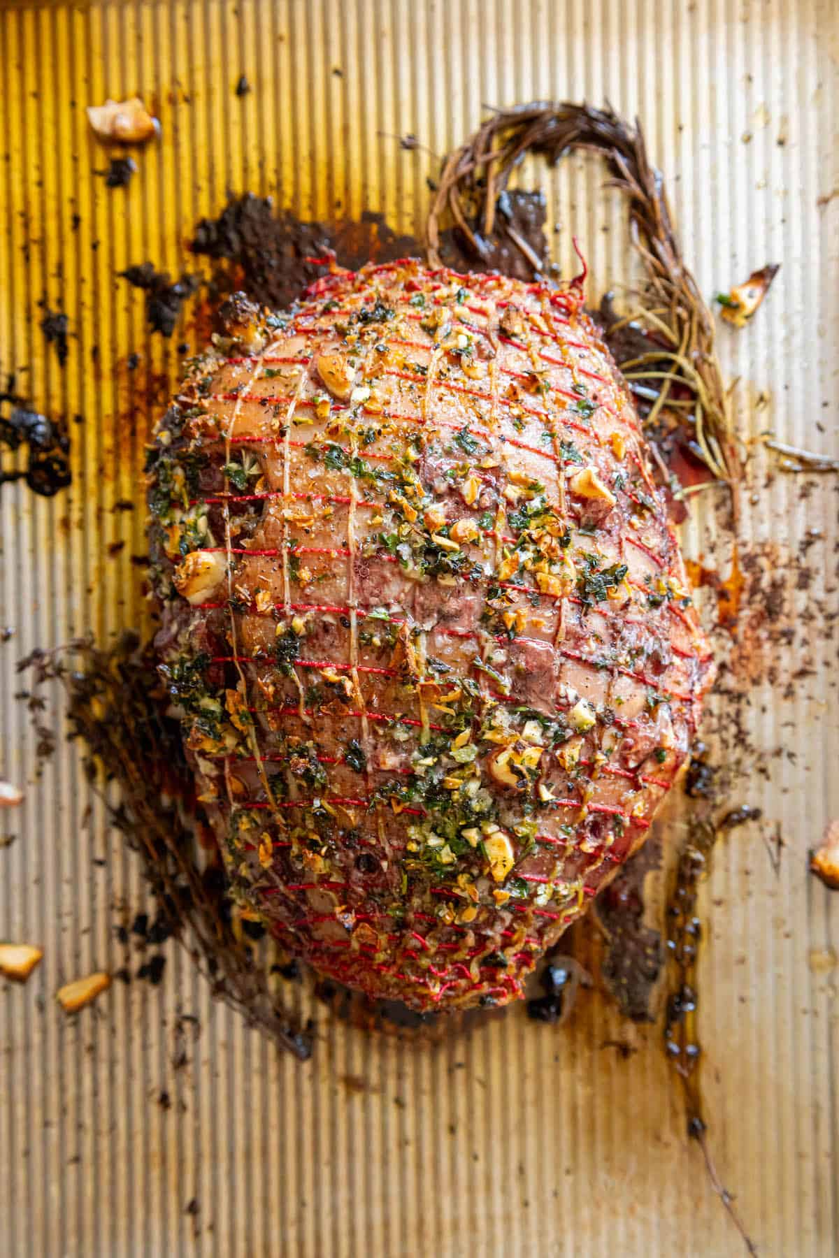 A Reverse Seared leg of lamb sitting on a baking sheet.