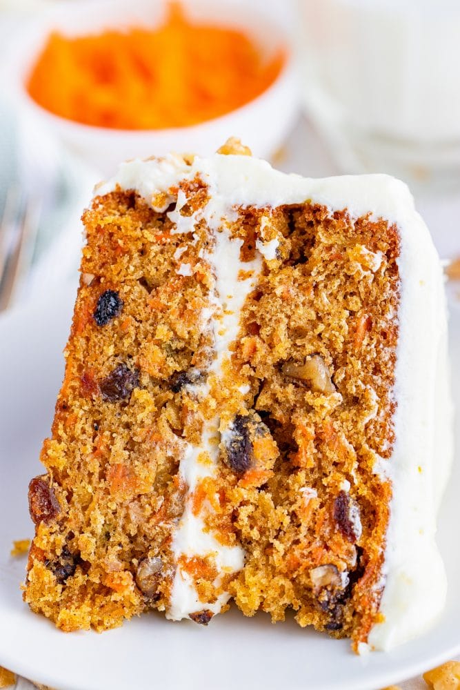 A slice of carrot cake on a plate.