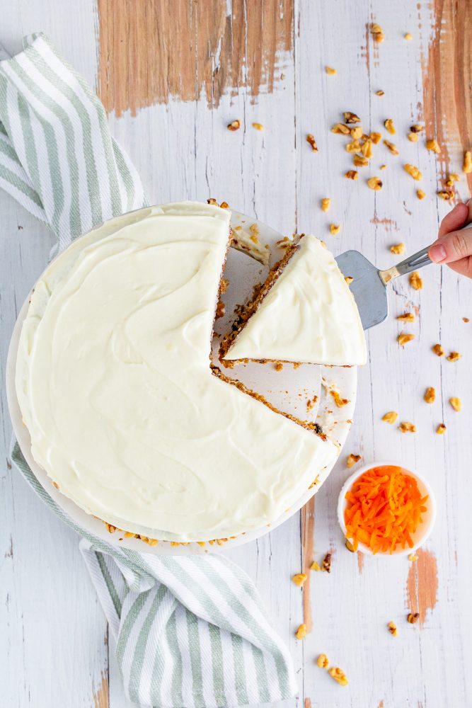 The Best Carrot Cake Recipe with a slice taken out of it.