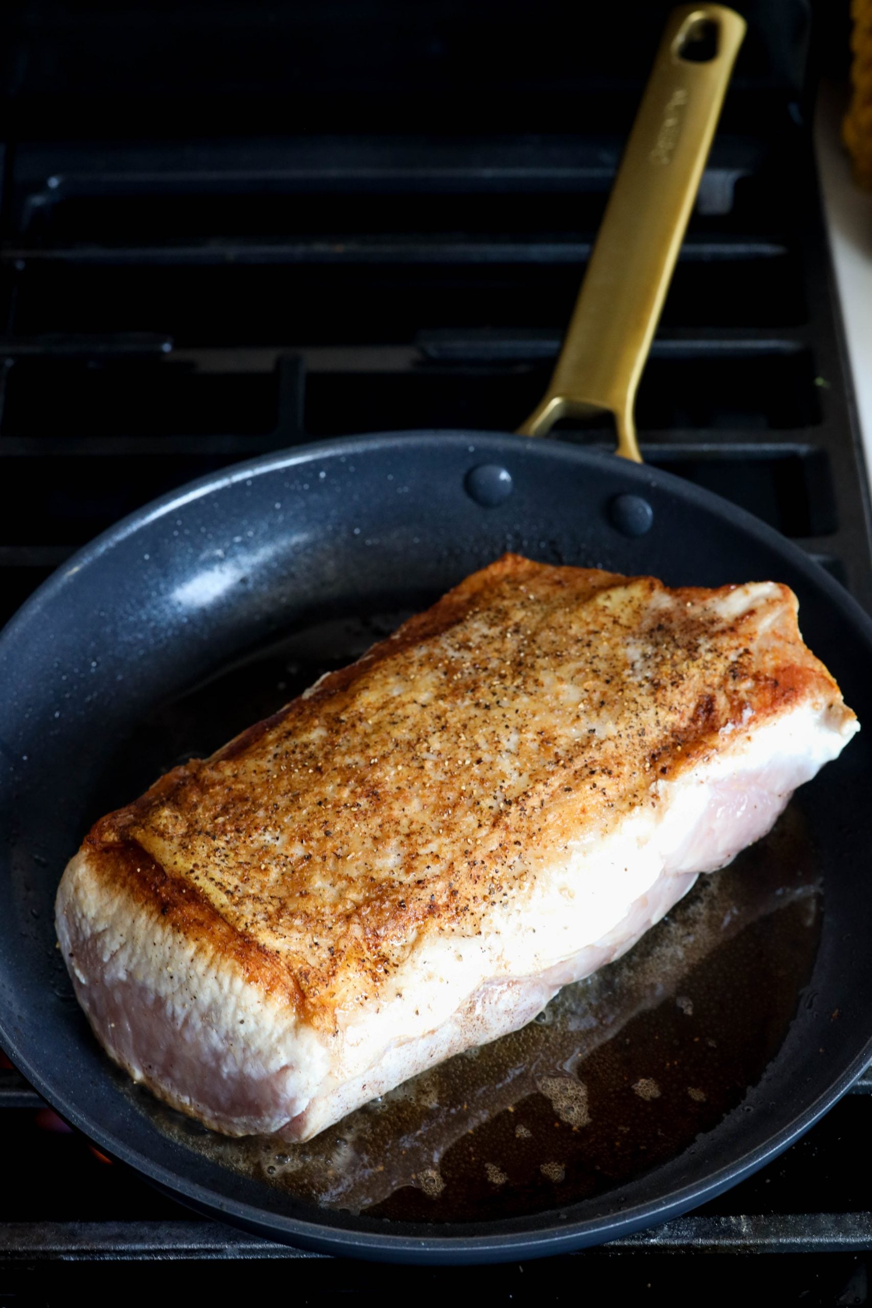 picture of pork loin browning in pan