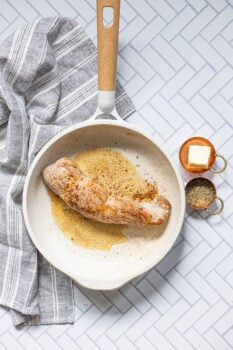 pan with browned pork tenderloin in it