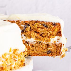 picture of layered carrot cake on a white plate