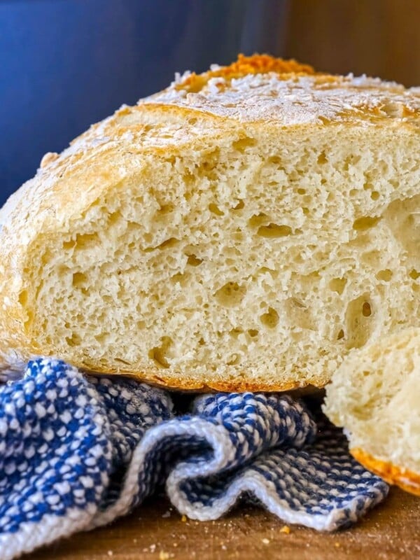 sliced artisan bread loaf on a cutting board