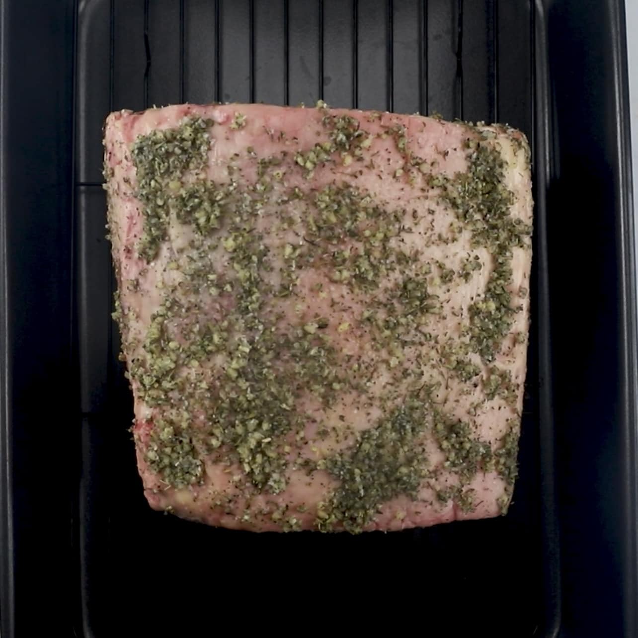 seasoned ribeye roast on roast pan