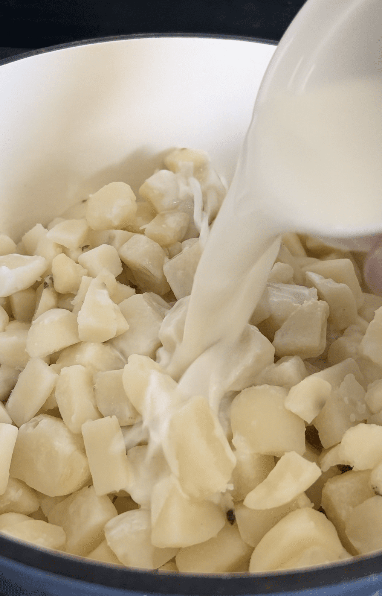 picture of milk and potatoes in a pan